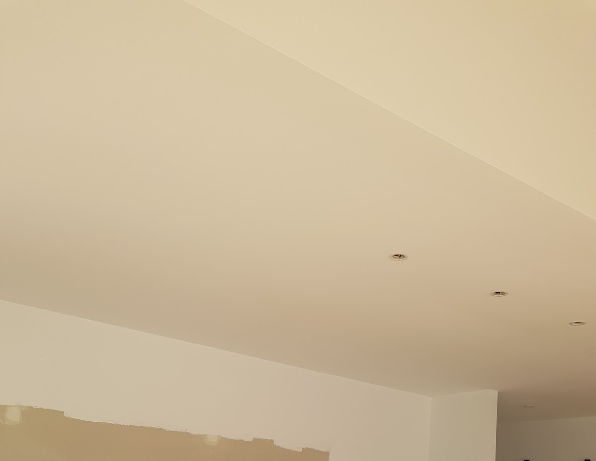 Kitchen ceiling and bulkhead mid-repair with a patched wall section